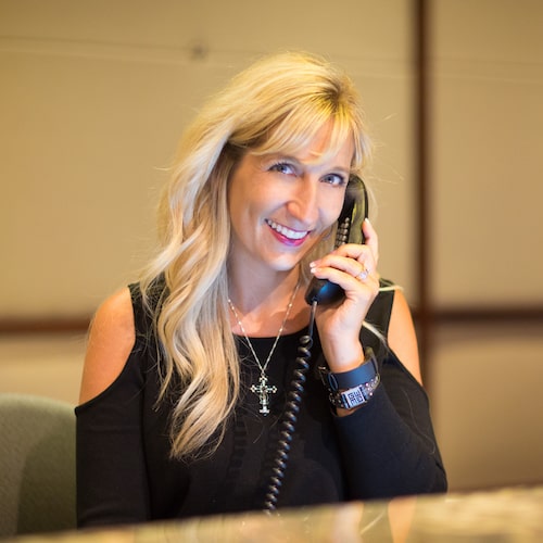 Blonde woman talking on the phone and smiling